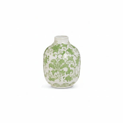 large white bud vase with green vining floral design