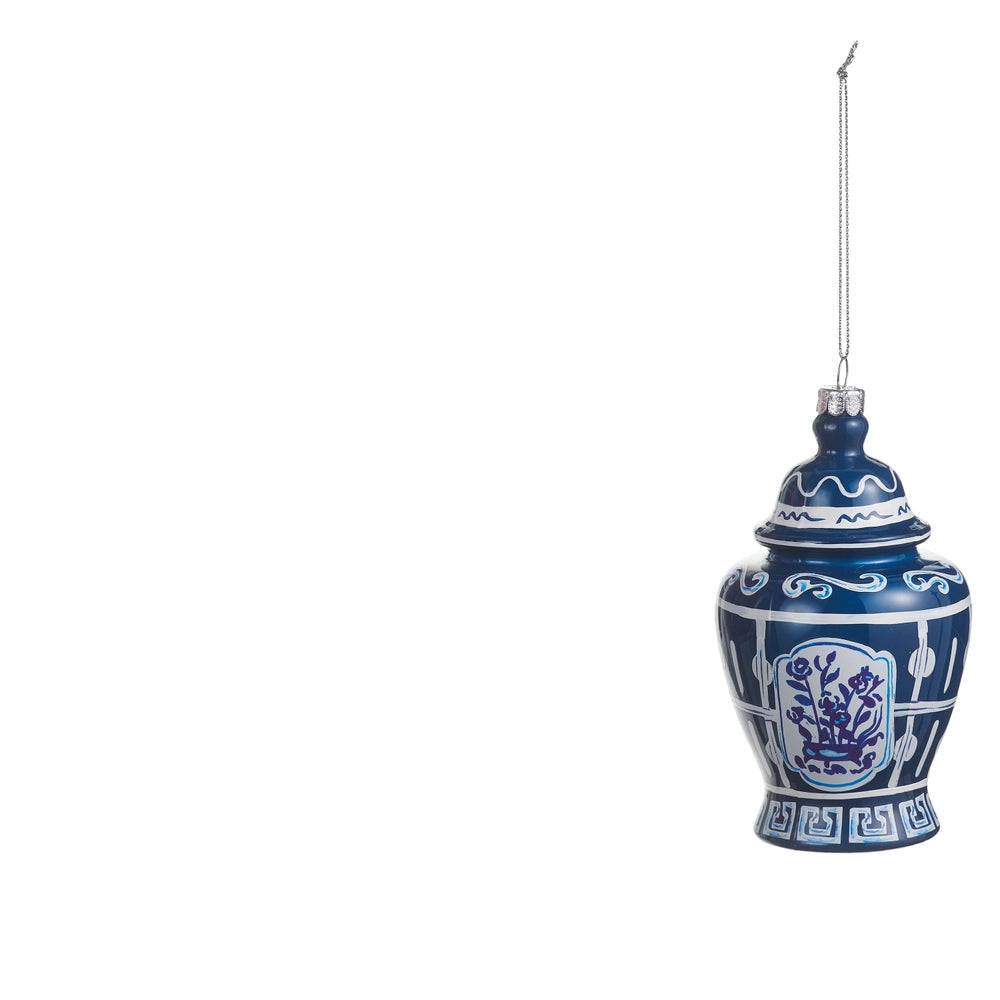 blue glass ginger jar ornament with white design on it