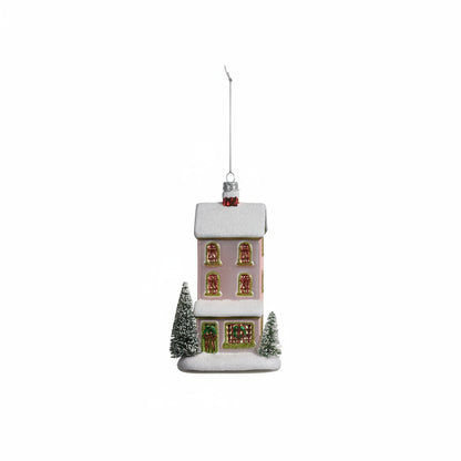 pale pink town house ornament with a green door on a white background