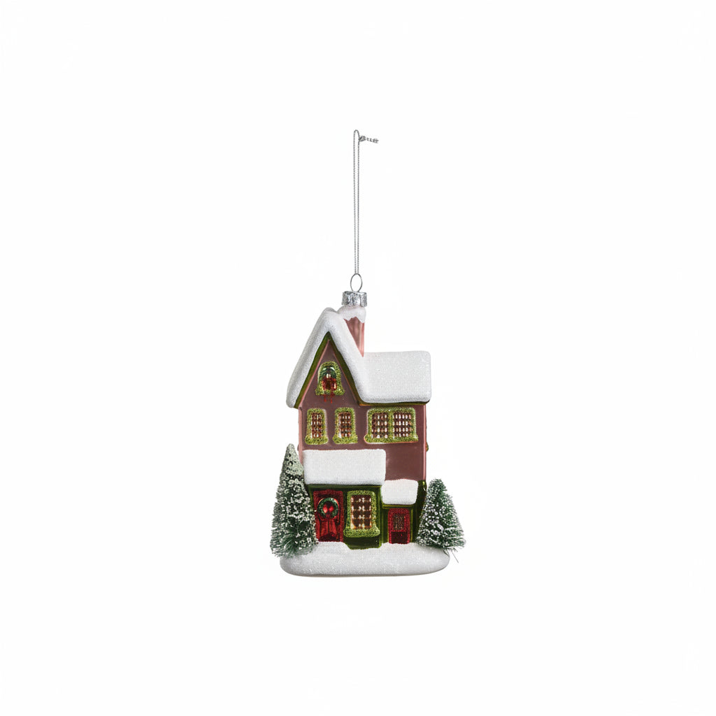 mauve color house ornament with a red door on a white background