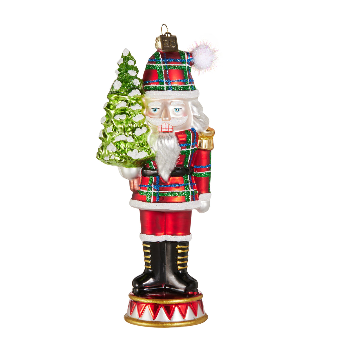 glass Nutcracker Ornament wearing red plaid suit and holding a small tree