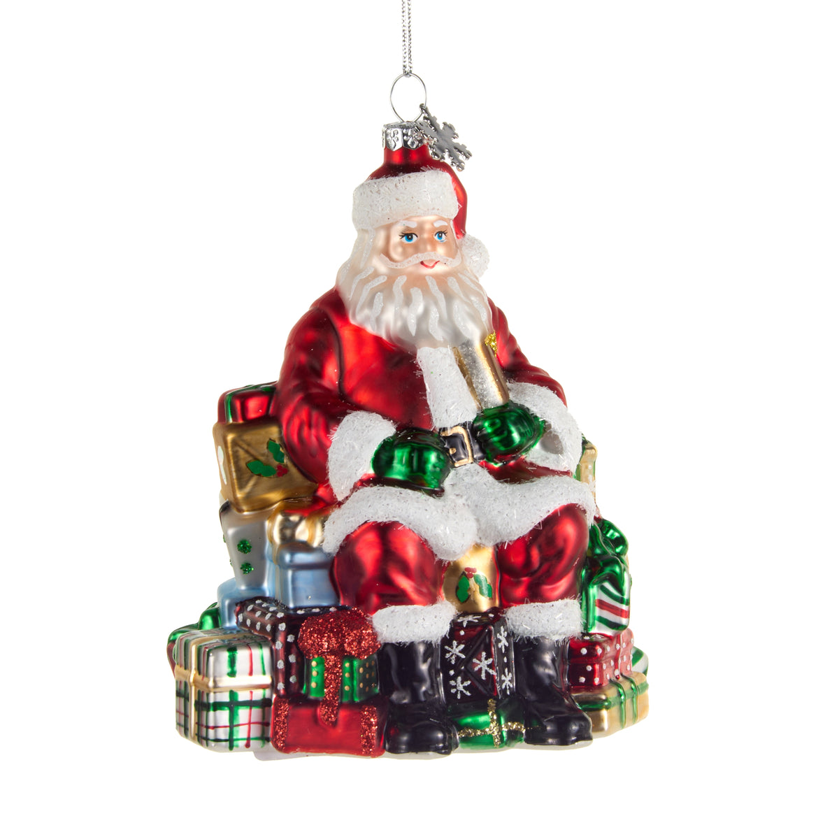glass Ornament of Santa sitting on colorful stack of presents ornament shown on a white background