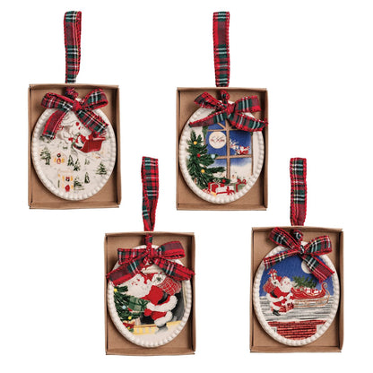 4 ornaments with vintage style santa scenes in their box packaging shown on a white background