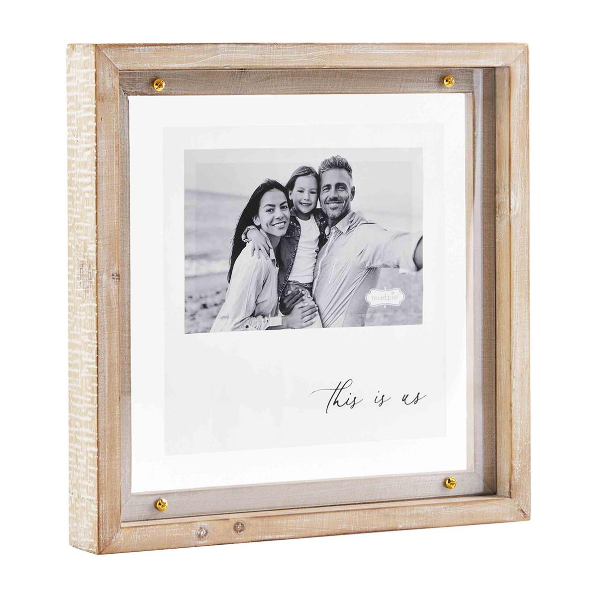 this is us whitewashed wood frame displayed against a white background