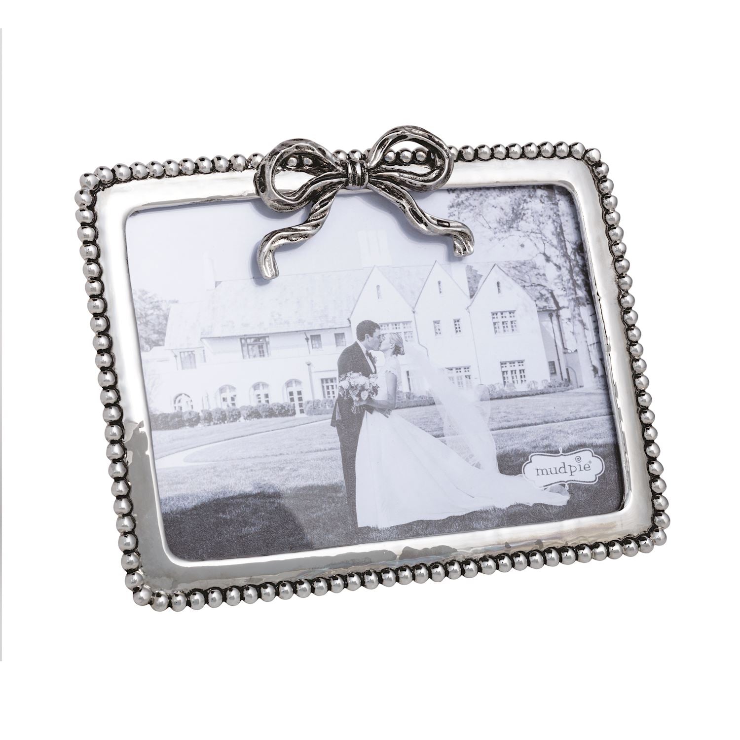 larger silver landscape frame with black and white wedding photo in it