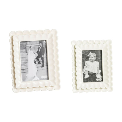 double scallop edge frames, one small and one large, with black and white photos in them