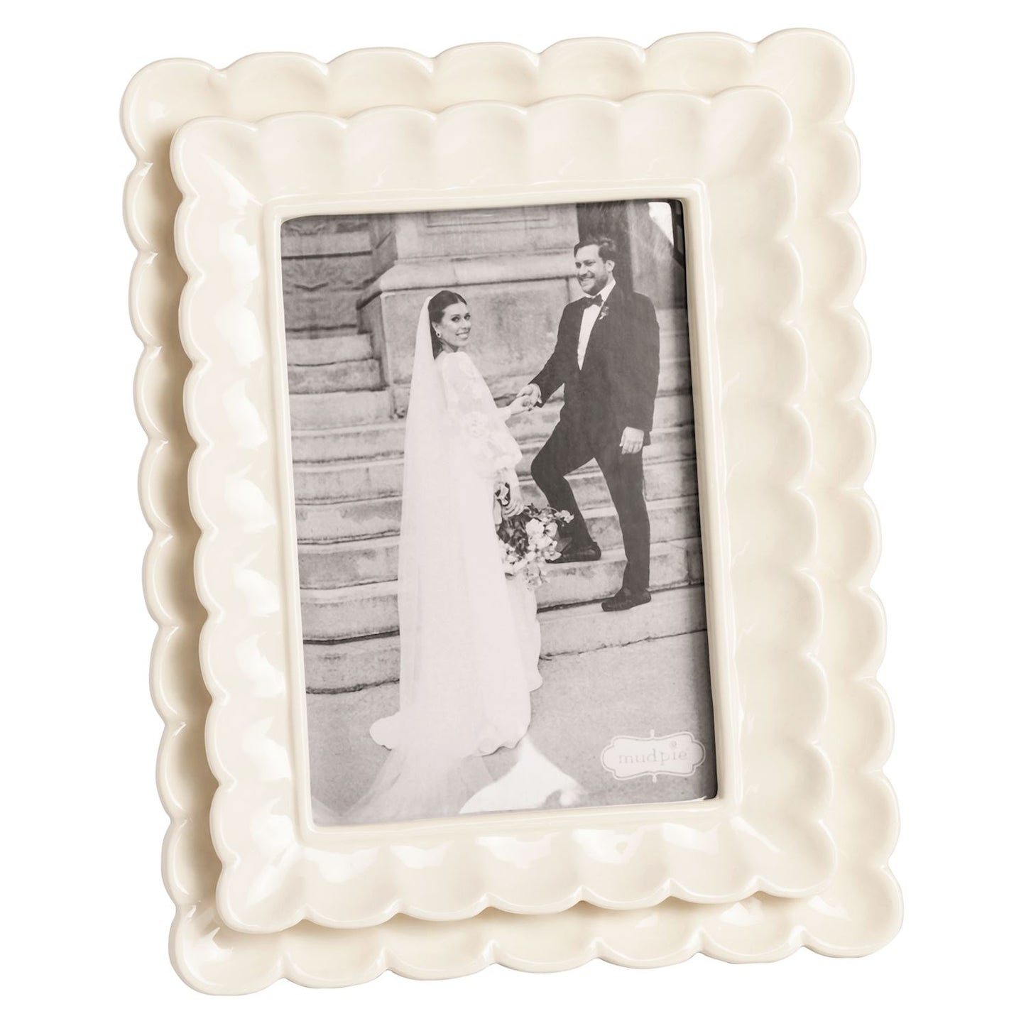 large White decorative photo frame with a black and white photo of a couple on a staircase.