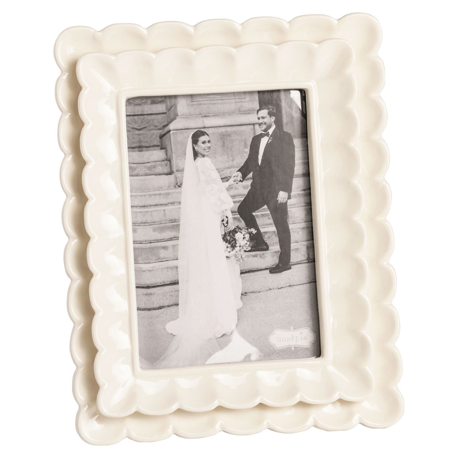 large White decorative photo frame with a black and white photo of a couple on a staircase.