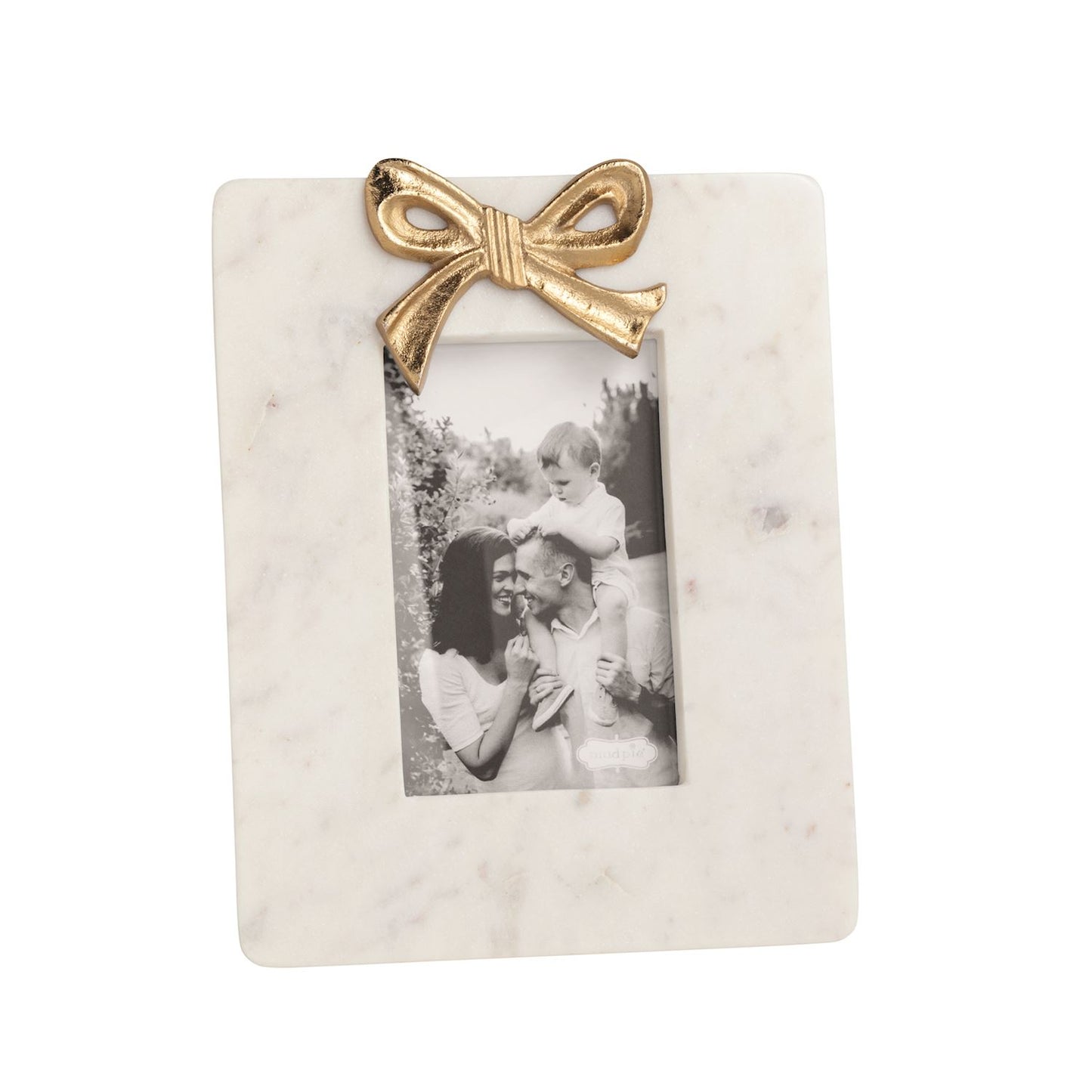 small white marble frame with gold bow and black and white picture in it