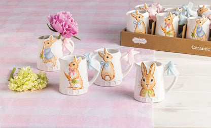 bunny bud vases  arranged on a pink gingham cloth with a pink flower