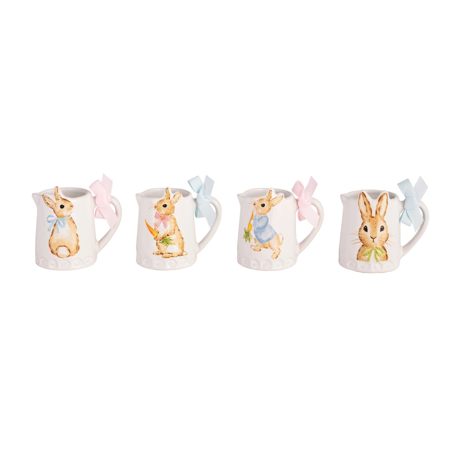 four mini ceramic pitchers with different images of bunnies on them