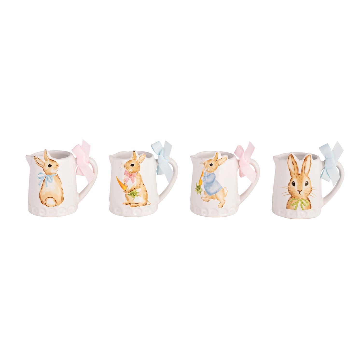 four mini ceramic pitchers with different images of bunnies on them