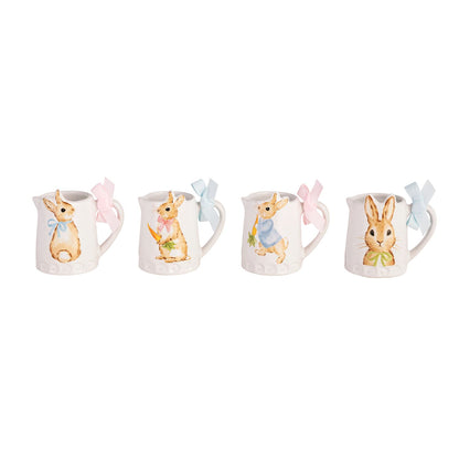 four mini ceramic pitchers with different images of bunnies on them