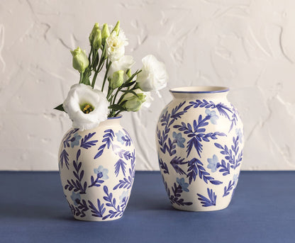 one small and one larger blue and white vine vase