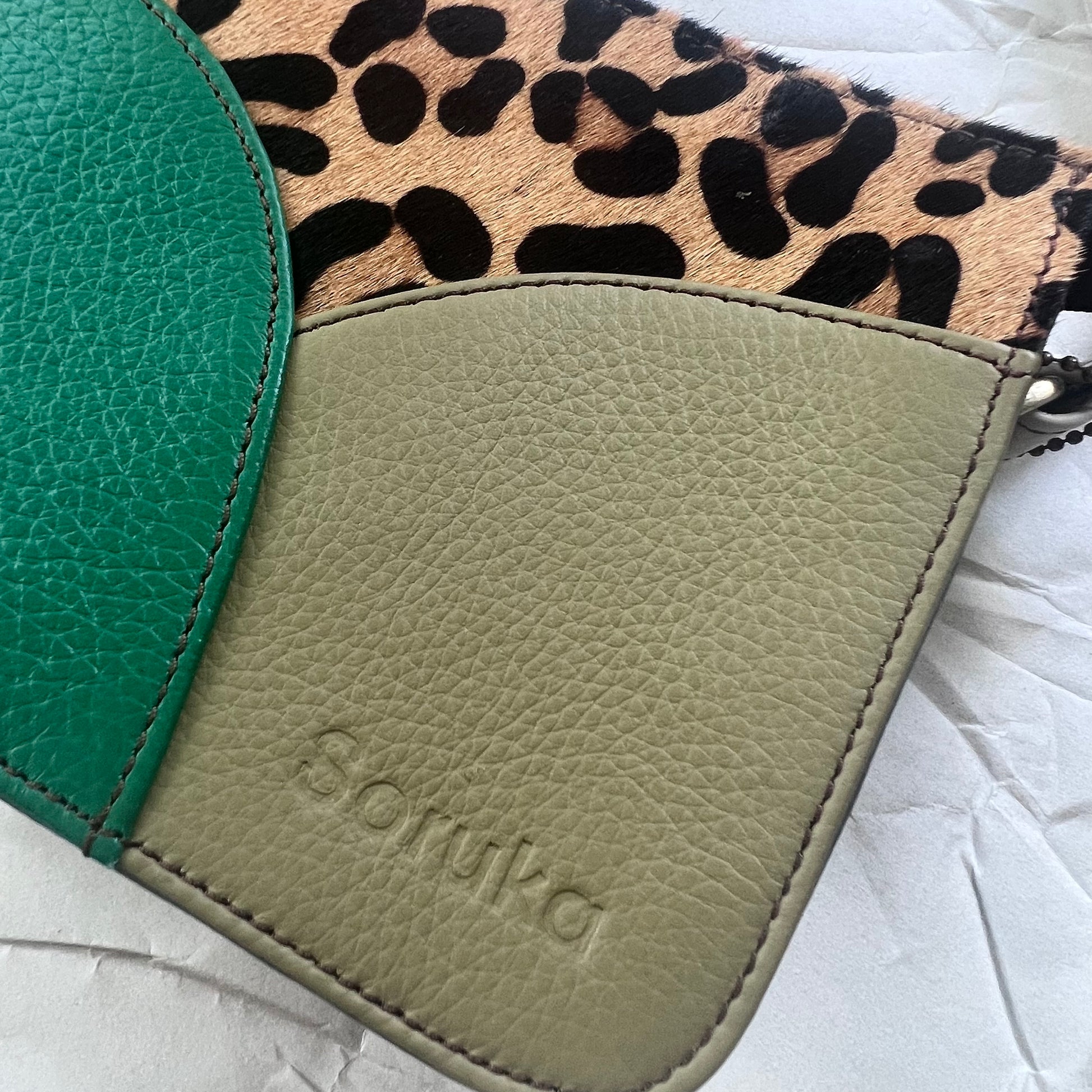 close-up of emerald Meredith Purse