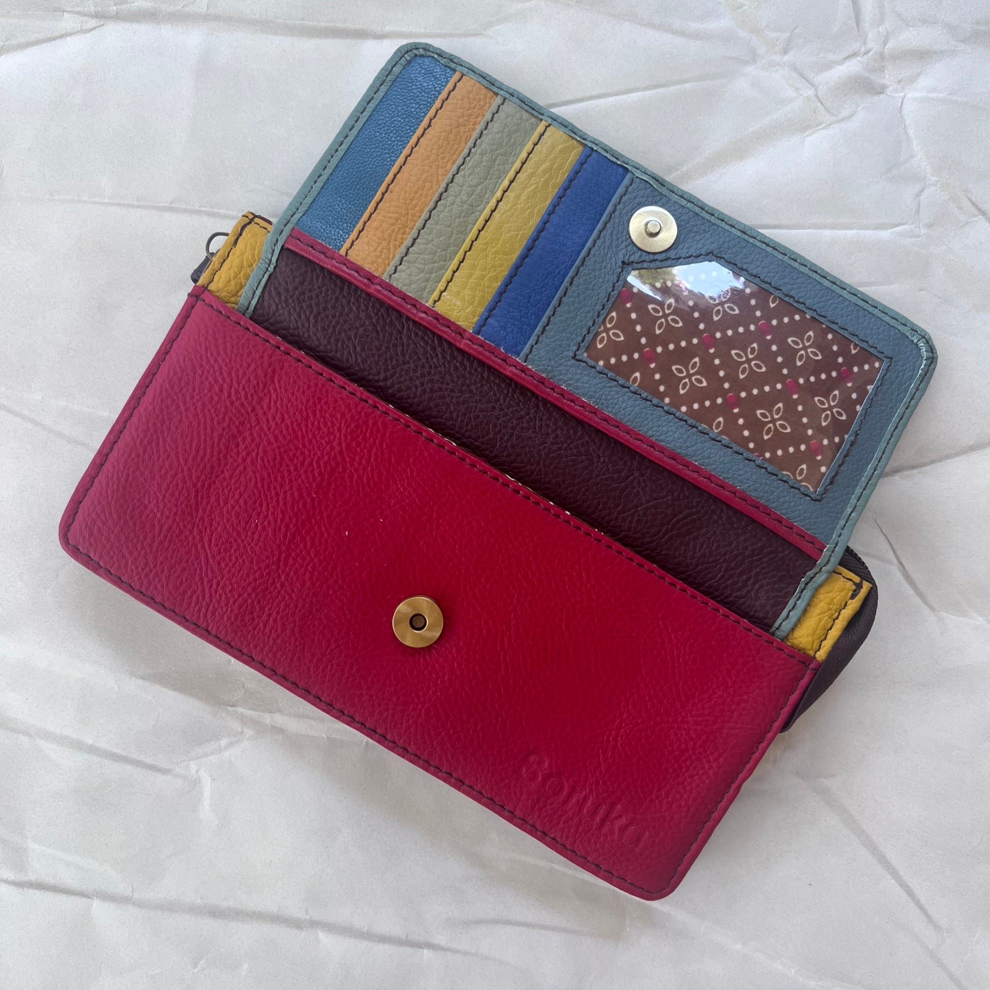 mint Targa Clutch Wallet with flap open showing colorful card slots