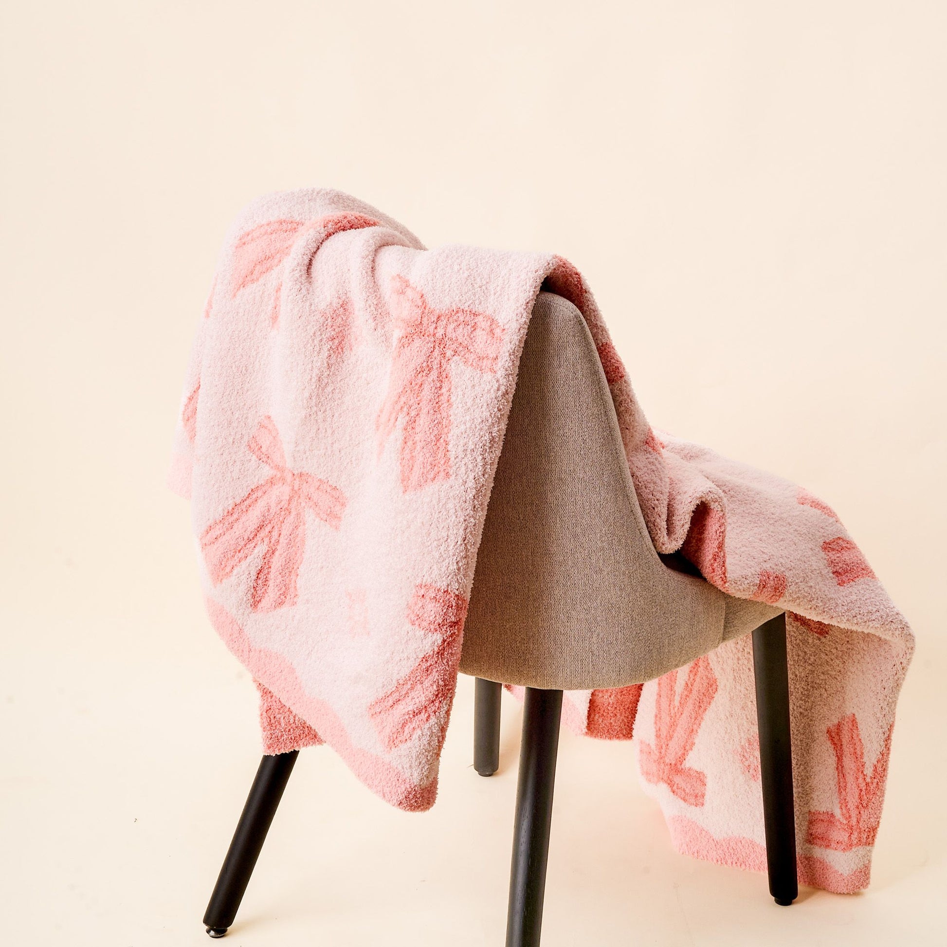 bow blanket draped over a chair