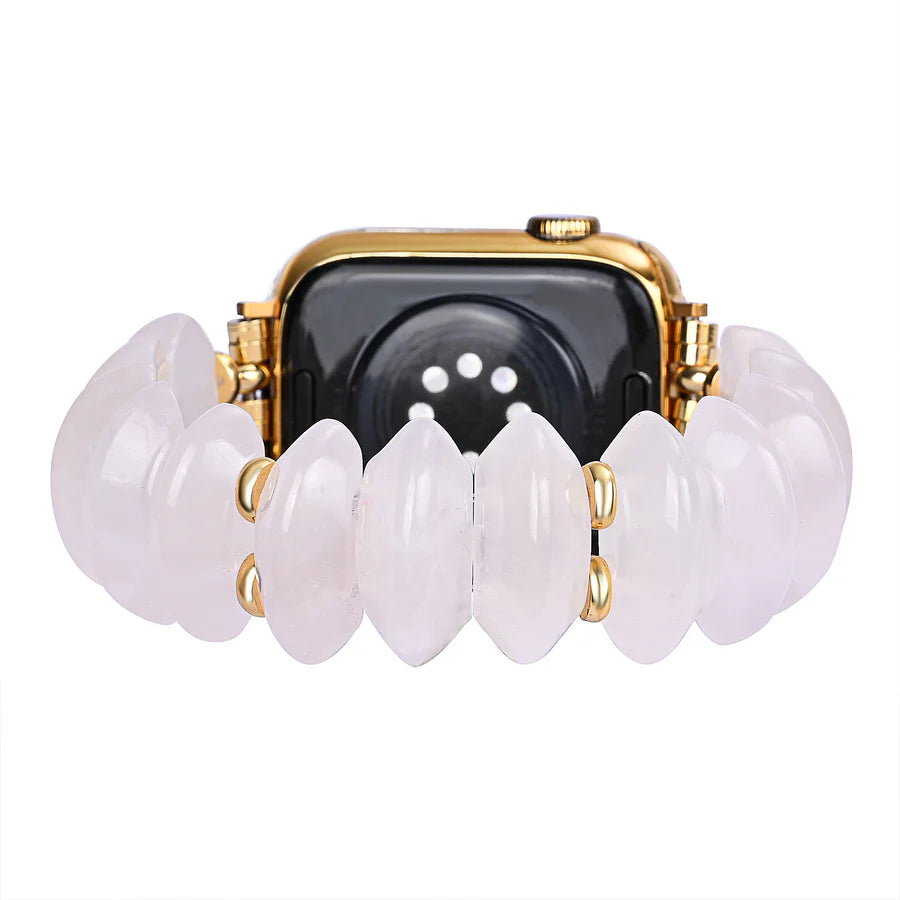 back view of Smartwatch with a gold and pale pink strap on a white background