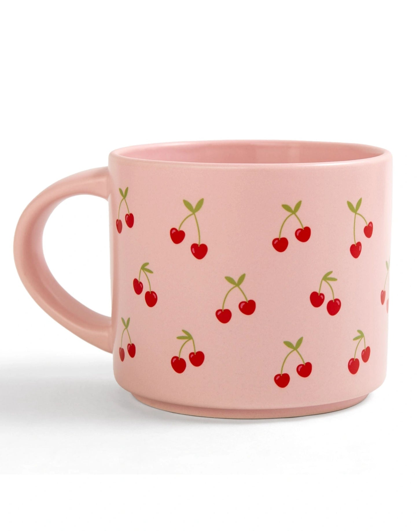 pink mug with red cherries printed on it