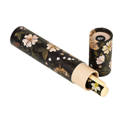 Floral-patterned tube with writing tube inside shown on a white background