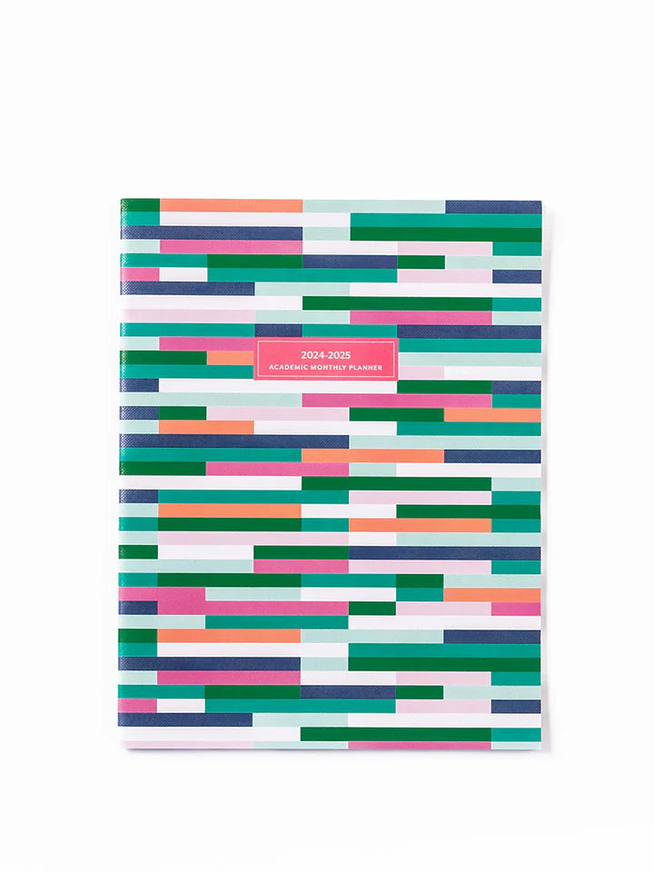 planner with horizontal lines in greens, blues, pink, and orange cover.