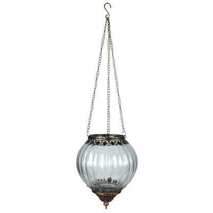 round glass lantern hanging from a chain.