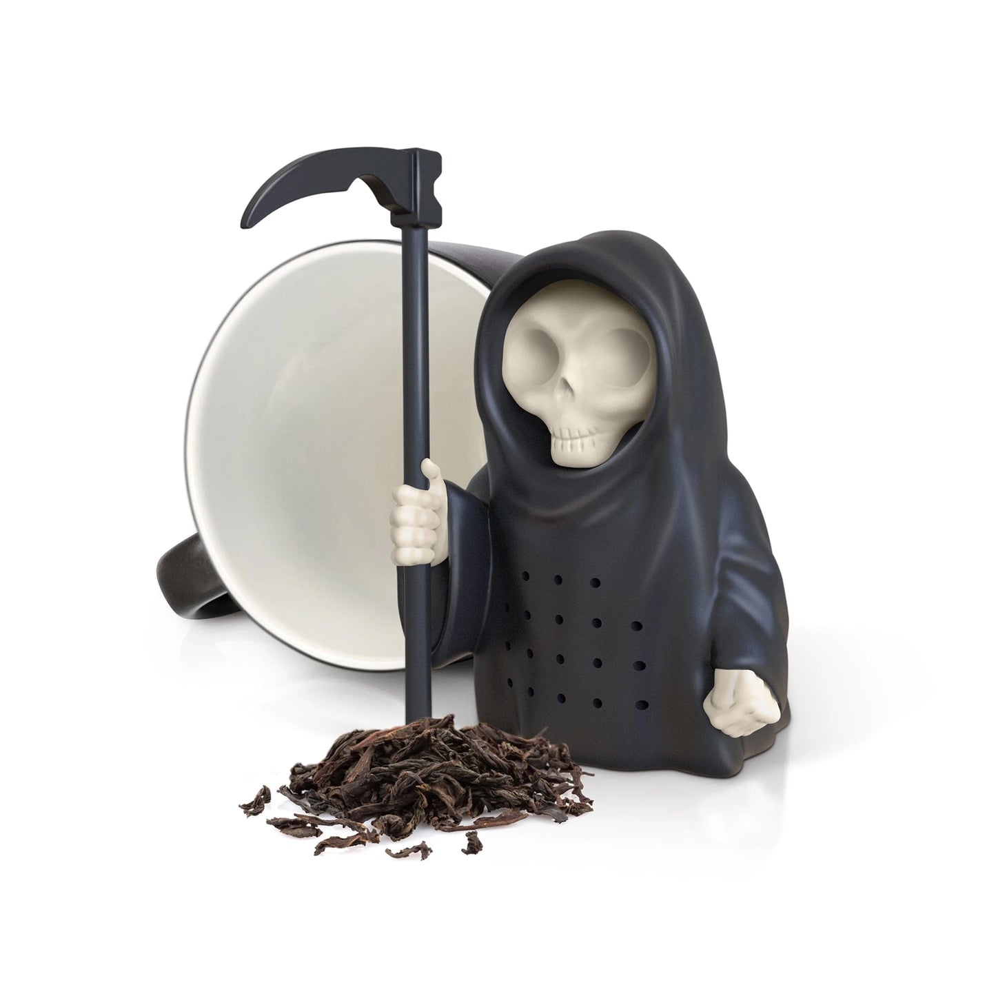 Grim Steeper Tea Infuser set next to a pile of loose tea and an empty mug.