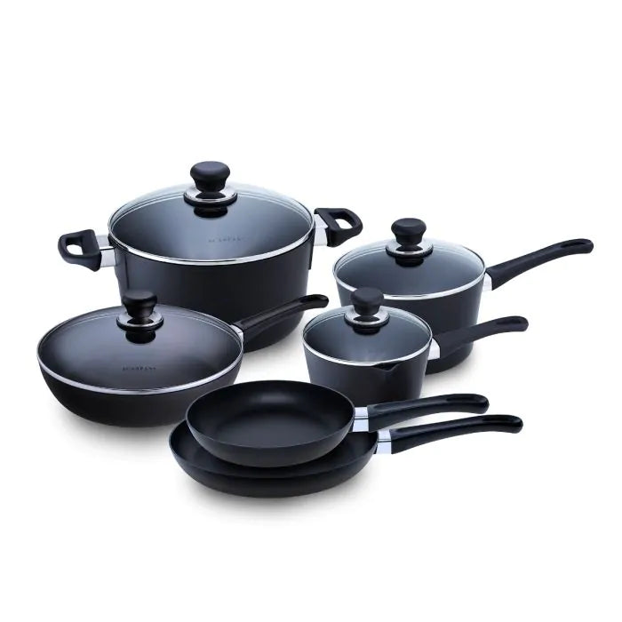 A 10 piece cookware set by ScanPan, including pots and pans with lids, in black color, some with lids, arranged on a white background