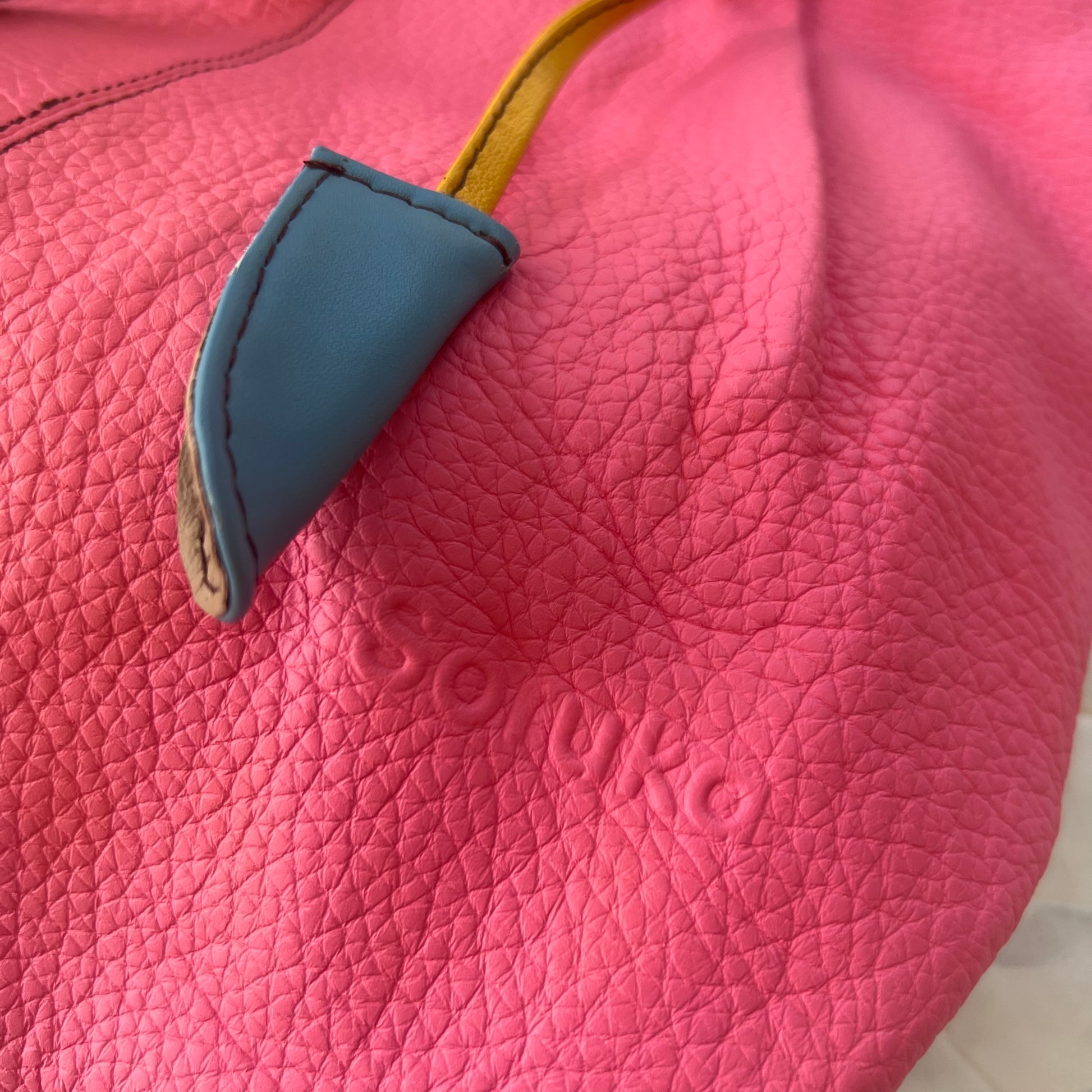 close-up of flamingo celine tote
