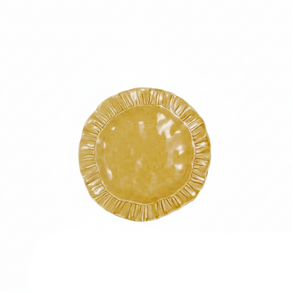 mustard yellow ruffle salad plate on a white background
