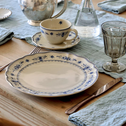 costa nova vila beige and blue dinner plate on a set table