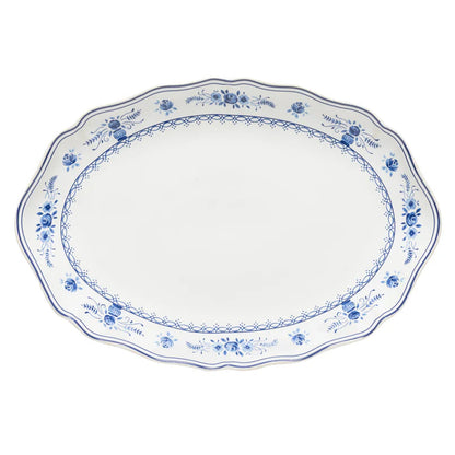White oval platter with blue floral patterns on a white background