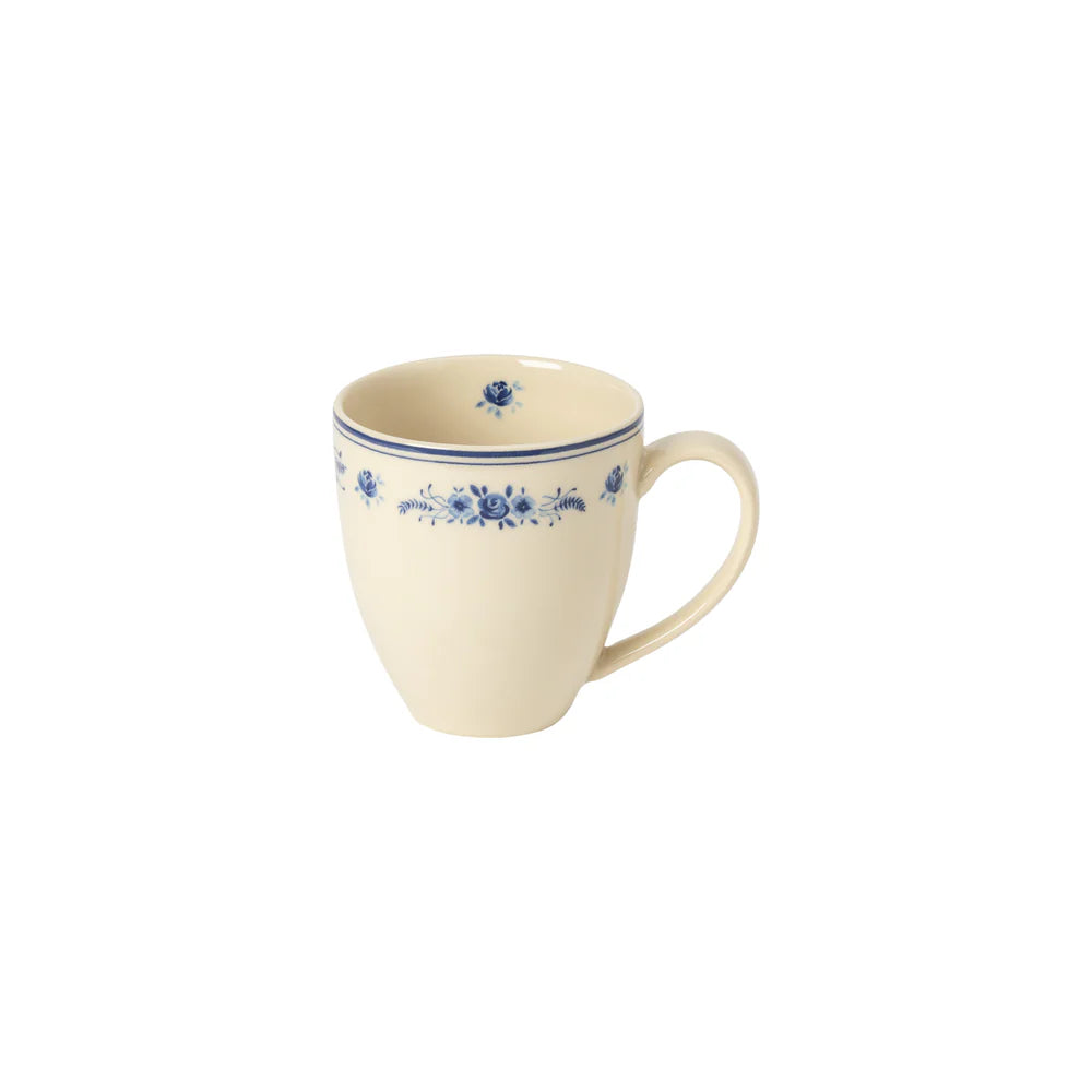beige Vila Mug with blue floral design shown on a white background