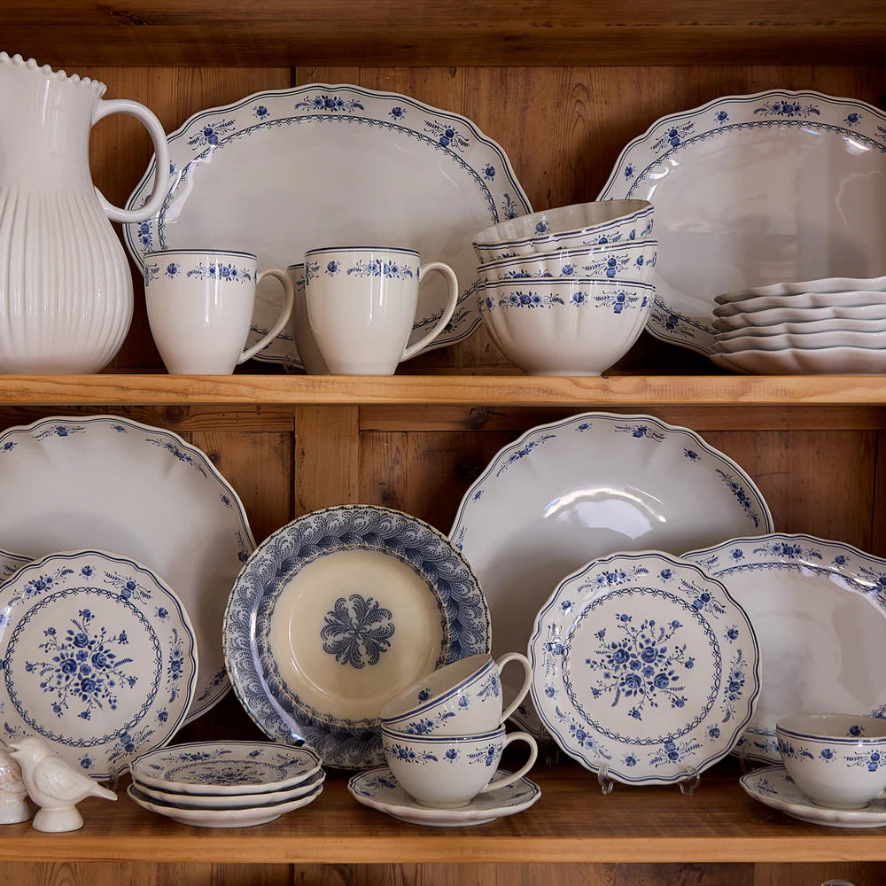 vila blue and white pattern in a hutch with various other dishes