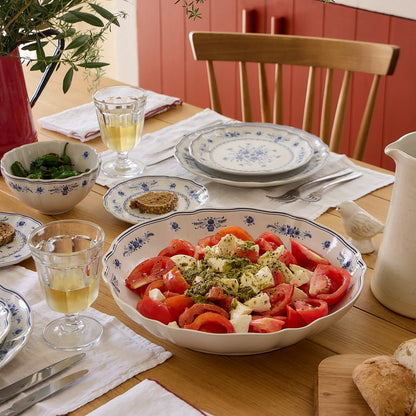 costa nova vila white and blue serving bowl on a set table