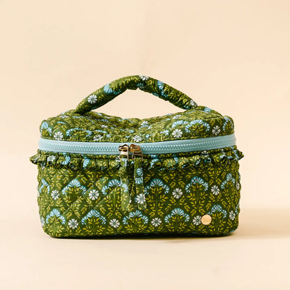 Everbloom Forest Green Glam & Go Quilted Cosmetic Bag shown on a beige background