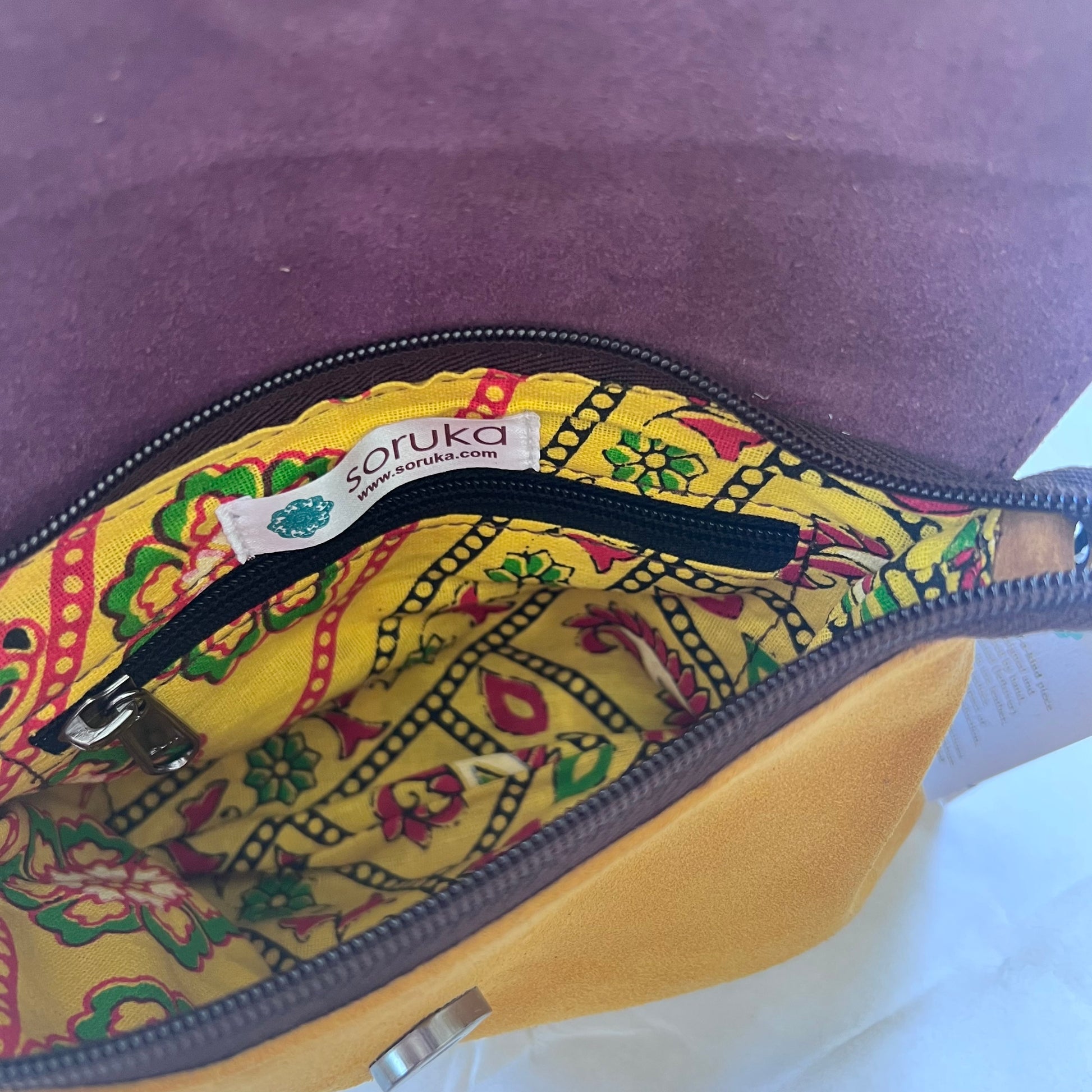 interior of bag showing inner zipper pocket.