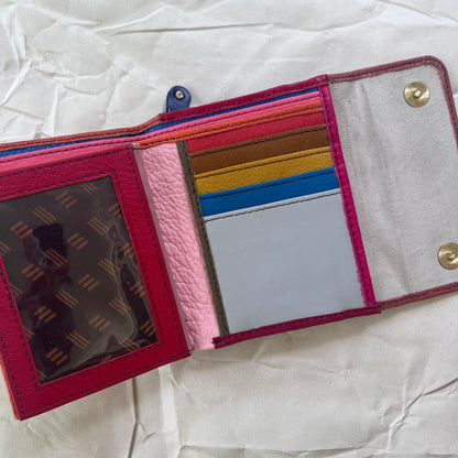 sunset rings wallet laying open showing colorful card slots