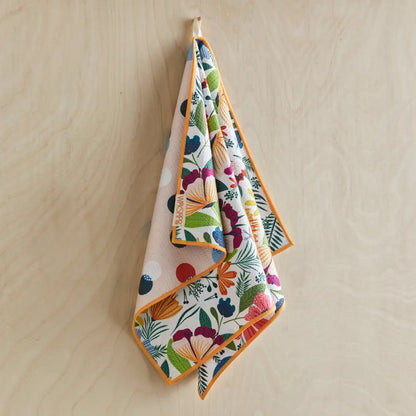 Fields Of Flowers Microfiber Dishtowel hanging on a hook