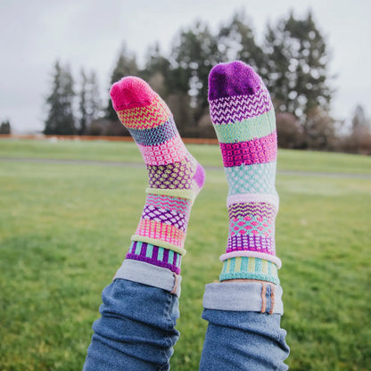 person wearing Dahlia Crew Socks with their feet up in the air