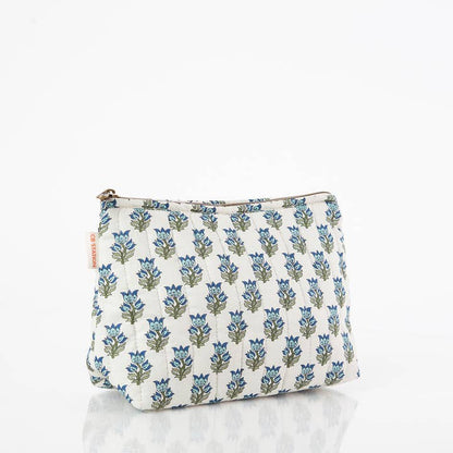 angled view of white zipper bag with aqua floral block print design