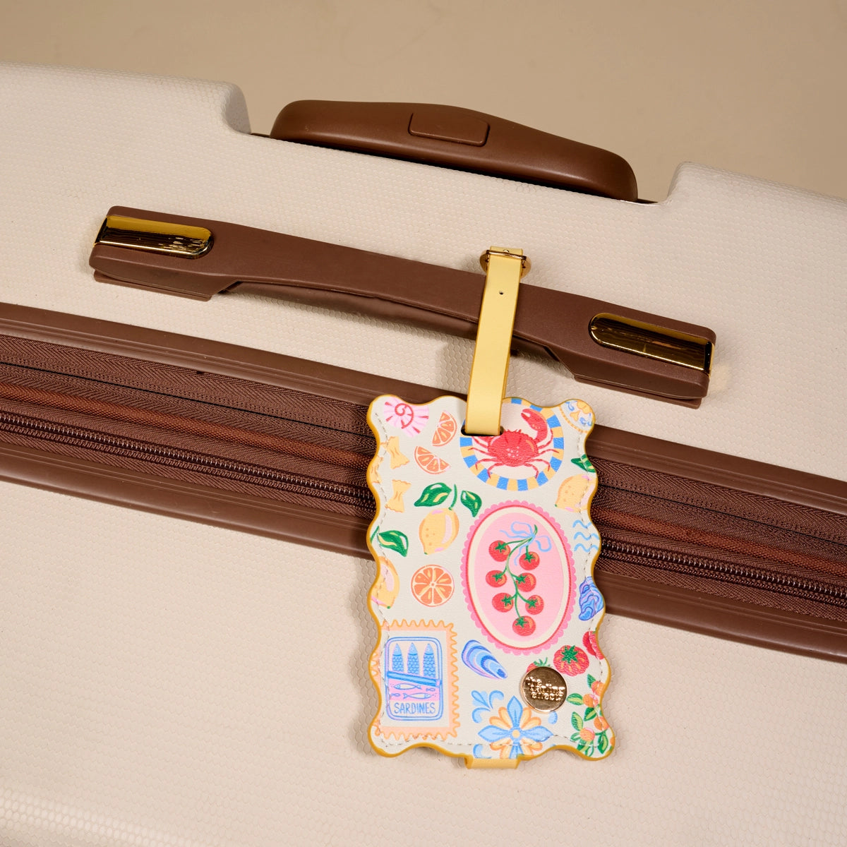 Colorful luggage tag attached to a suitcase handle