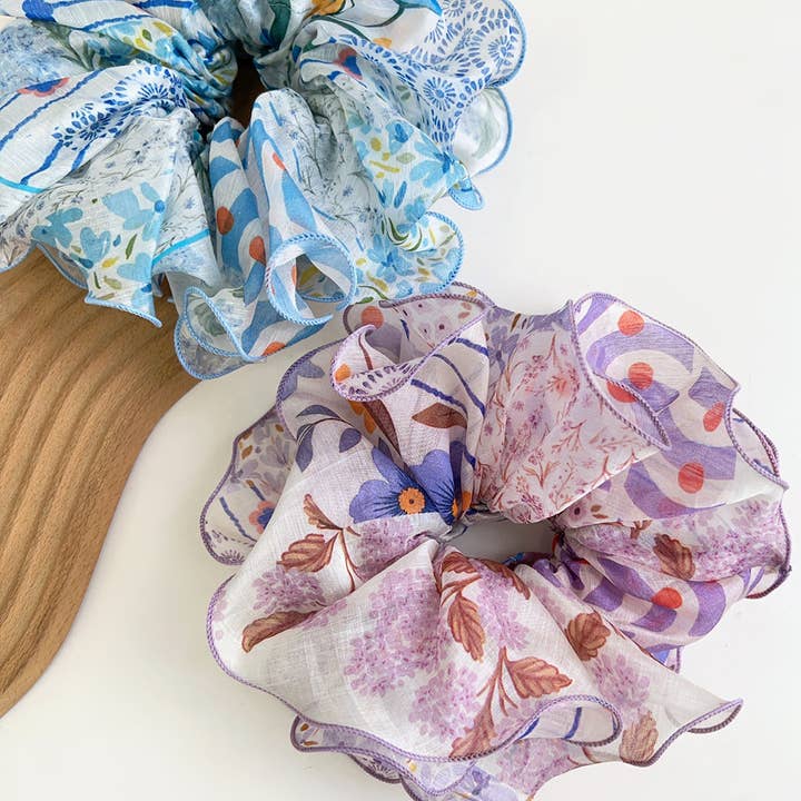 2 patchwork scrunchies on a white background