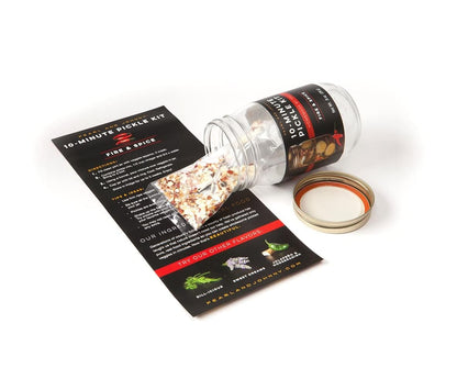 Pearl & Johnny's fire and spice Pickle Kit with directions and seasoning pouch arranged on a white surface.