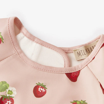 close-up of neck line of strawberry long sleeve bib