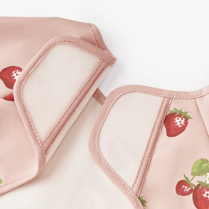 close-up of velcro closure on strawberry long sleeve bib