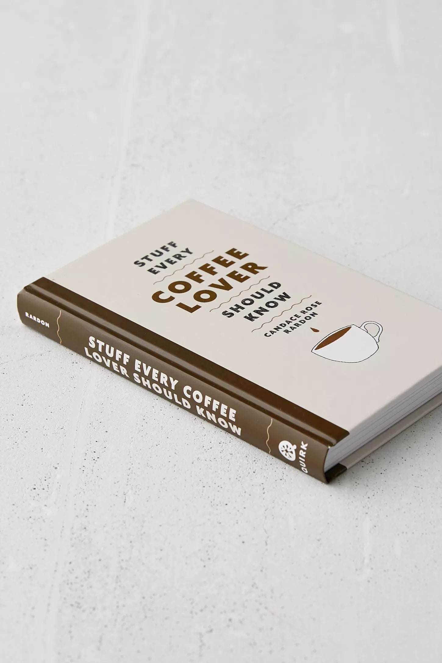 Book titled 'Stuff Every Coffee Lover Should Know' on a light gray surface