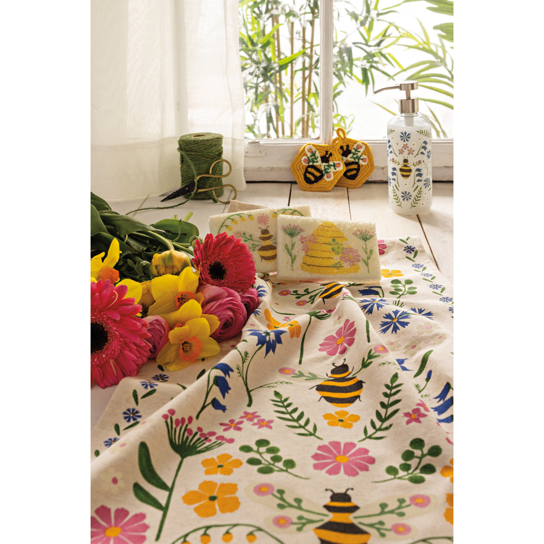 bee garden dishtowel laying in a decorative setting