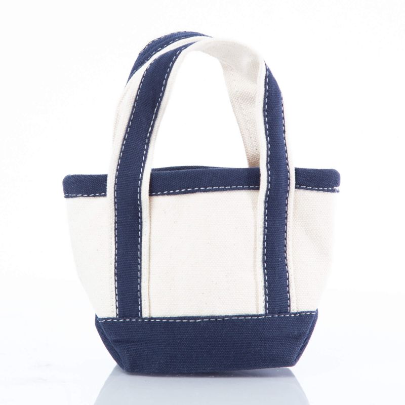 off white mini tote bag with navy blue handles and trim