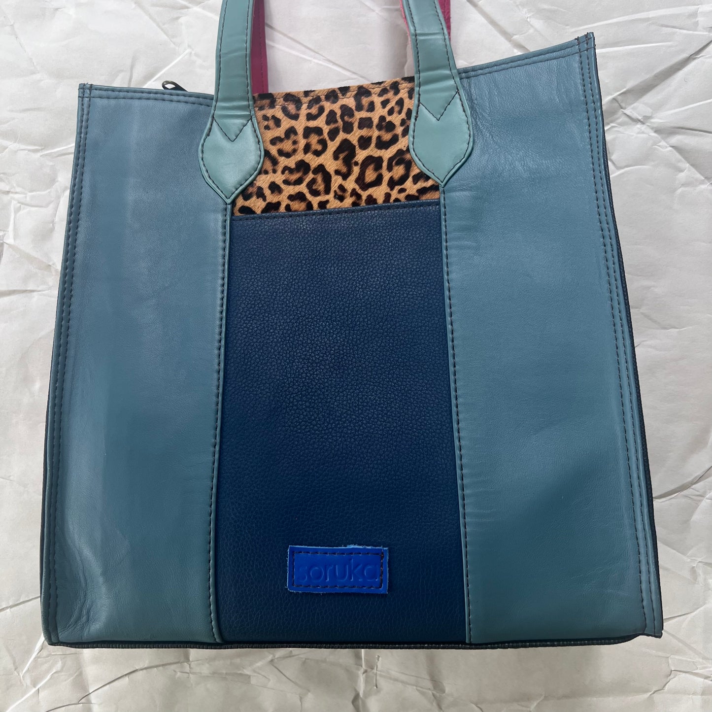 Peacock & Cranberry giselle tote showing blue hue side